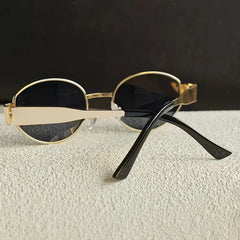 Zonnebril met ovaal metallic frame