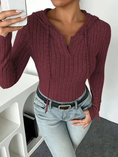 Bodysuit met capuchon en lange mouwen