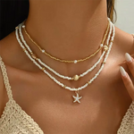 Ketting met schelp en ster