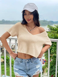 Beige crop top met V-hals