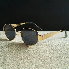 Zonnebril met ovaal metallic frame