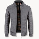 Gequilt jas met rits en ronde hals