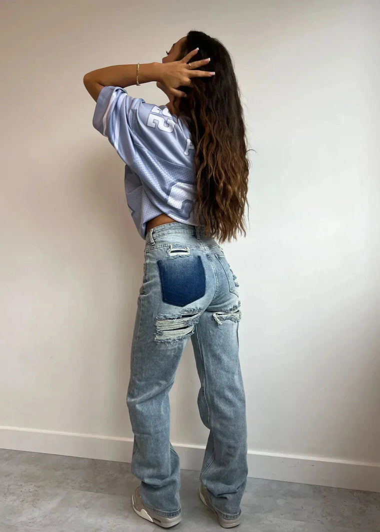 High waist jeans met gescheurde details