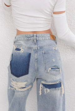 High waist jeans met gescheurde details