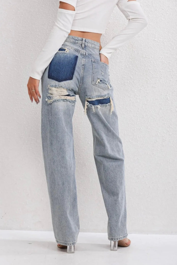 High waist jeans met gescheurde details