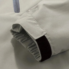 Windbreaker jas met capuchon en borstzak met rits
