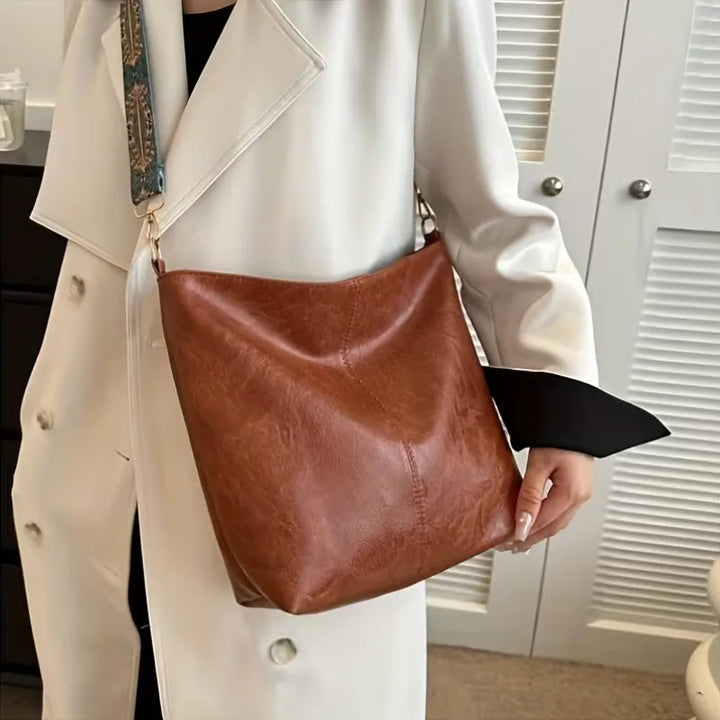 Schoudertas met kleurrijke strap