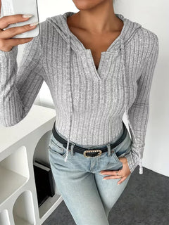 Bodysuit met capuchon en lange mouwen