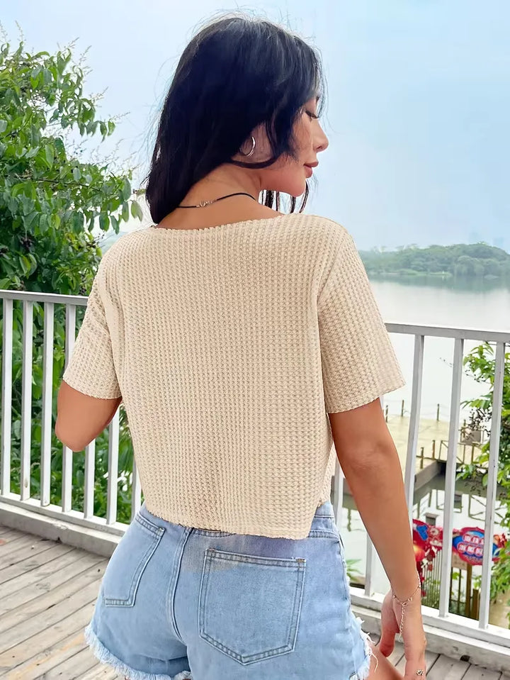 Beige crop top met V-hals