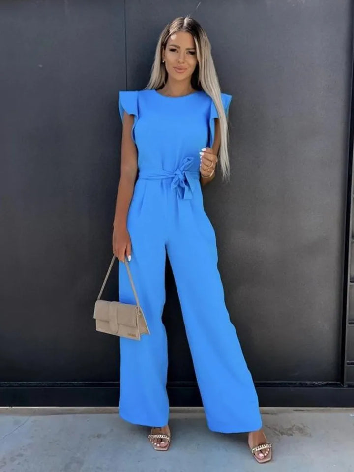 Deze jumpsuit combineert stijl, comfort en speelsheid met prachtige ruches mouwen en een ceintuur voor een flatterende en trendy uitstraling, geschikt voor diverse gelegenheden. Gemaakt van hoogwaardige materialen en veelzijdig inzetbaar voor zowel formele als informele events. Maattabel beschikbaar voor diverse EU-maten.