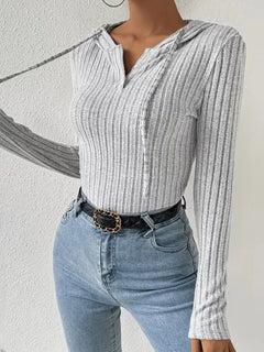 Bodysuit met capuchon en lange mouwen