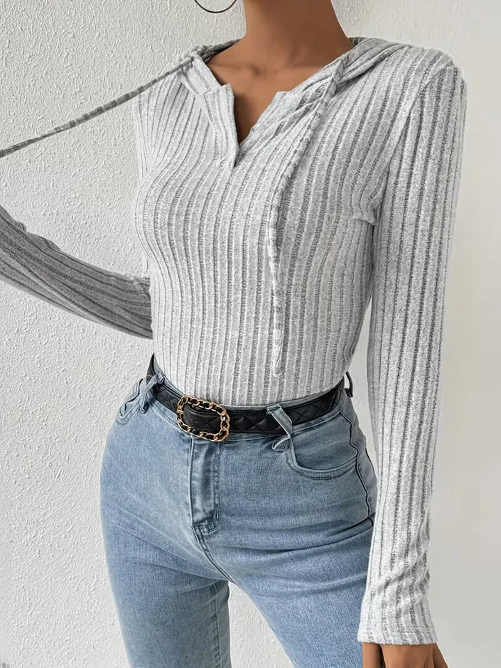 Bodysuit met capuchon en lange mouwen