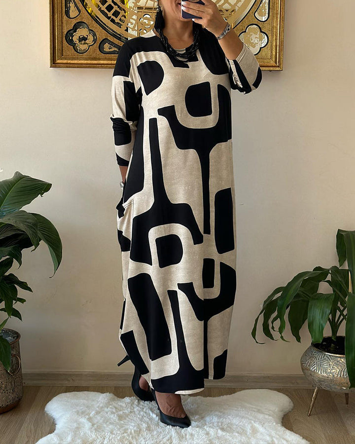 Jurk met lange mouwen en zwart witte print in de kleur Zwart voor dames in stijl ideaal voor de herfst.