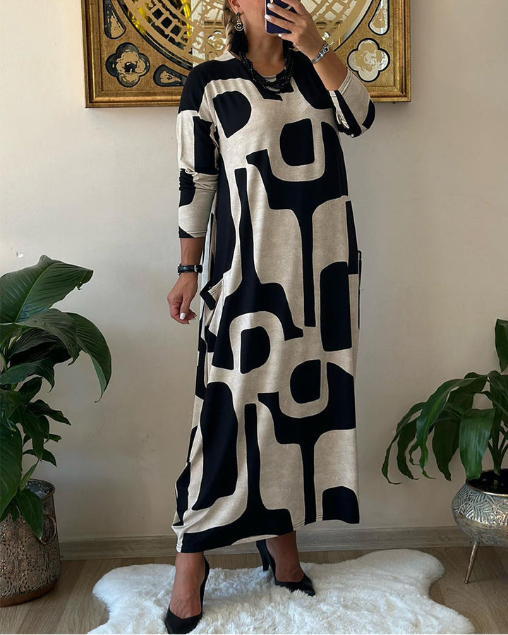 Jurk met lange mouwen en zwart witte print in de kleur Zwart voor dames in stijl ideaal voor de herfst.