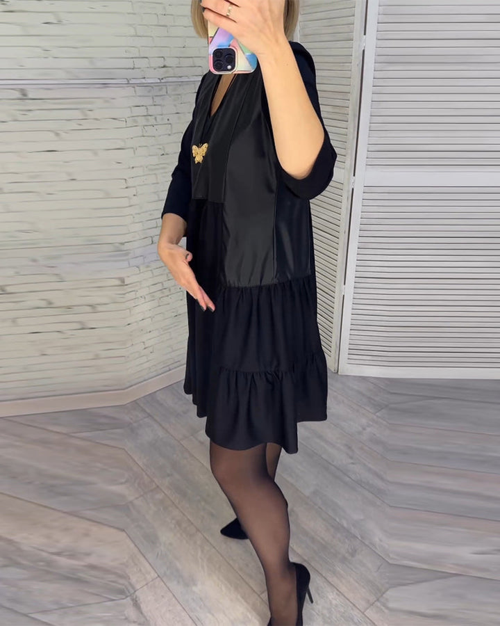 Jurk met V-hals en patchwork in de kleur Zwart voor dames in stijl ideaal voor de herfst.