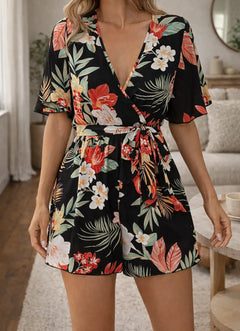 Romper met bloemenprint en taille ceintuur