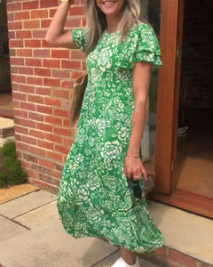 Lange jurk met korte mouwen en een bloemenprint in de kleur Groen voor dames in stijl ideaal voor de herfst.