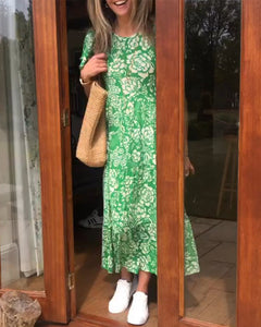 Lange jurk met korte mouwen en een bloemenprint in de kleur Groen voor dames in stijl ideaal voor de herfst.