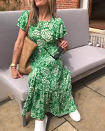 Lange jurk met korte mouwen en een bloemenprint in de kleur Groen voor dames in stijl ideaal voor de herfst.