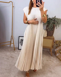 Mouwloze geplooide eenvoudige effen kleur jurk in de kleur Beige voor dames in stijl ideaal voor de herfst.