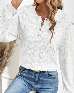 Effen topje met knopen in de kleur Wit voor dames in stijl ideaal voor de herfst.